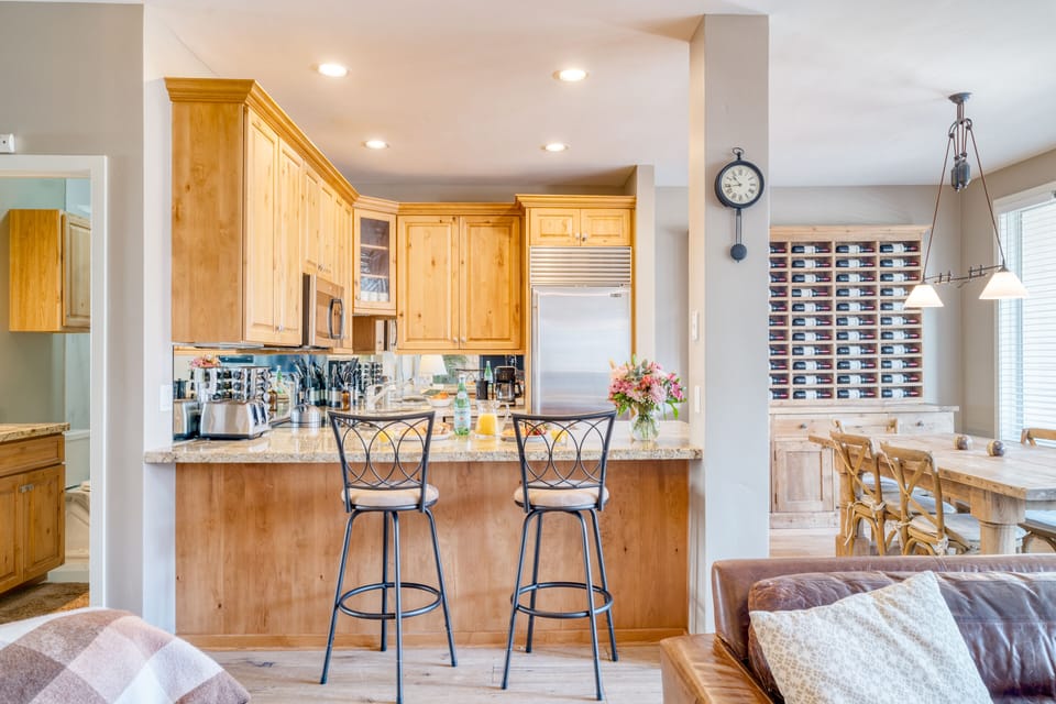 Kitchen is fully equipped and features stainless steel appliances.
