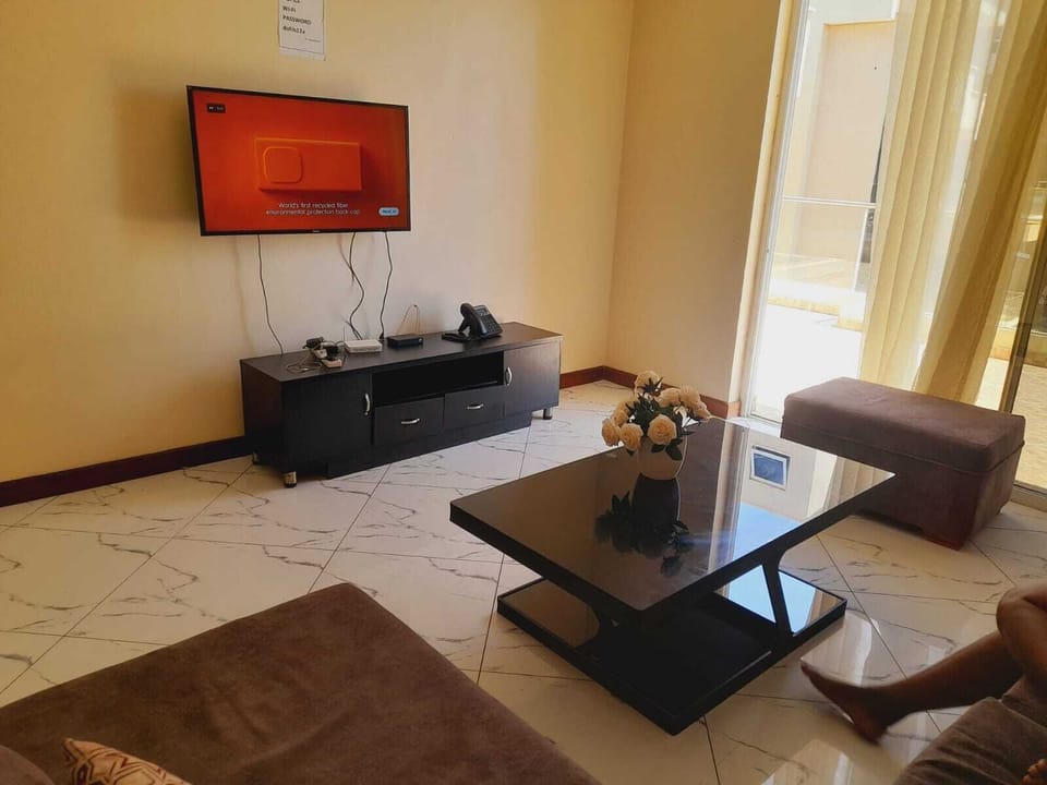 Deluxe Apartment | Living area | 24-inch Smart TV with digital channels