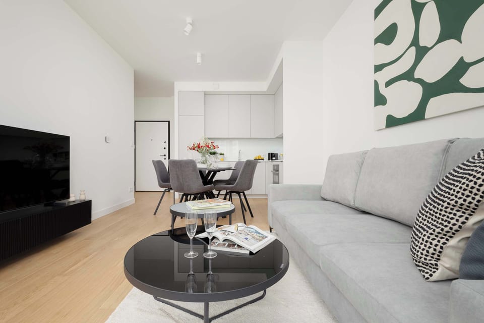 Spacious living room with dining area and large windows