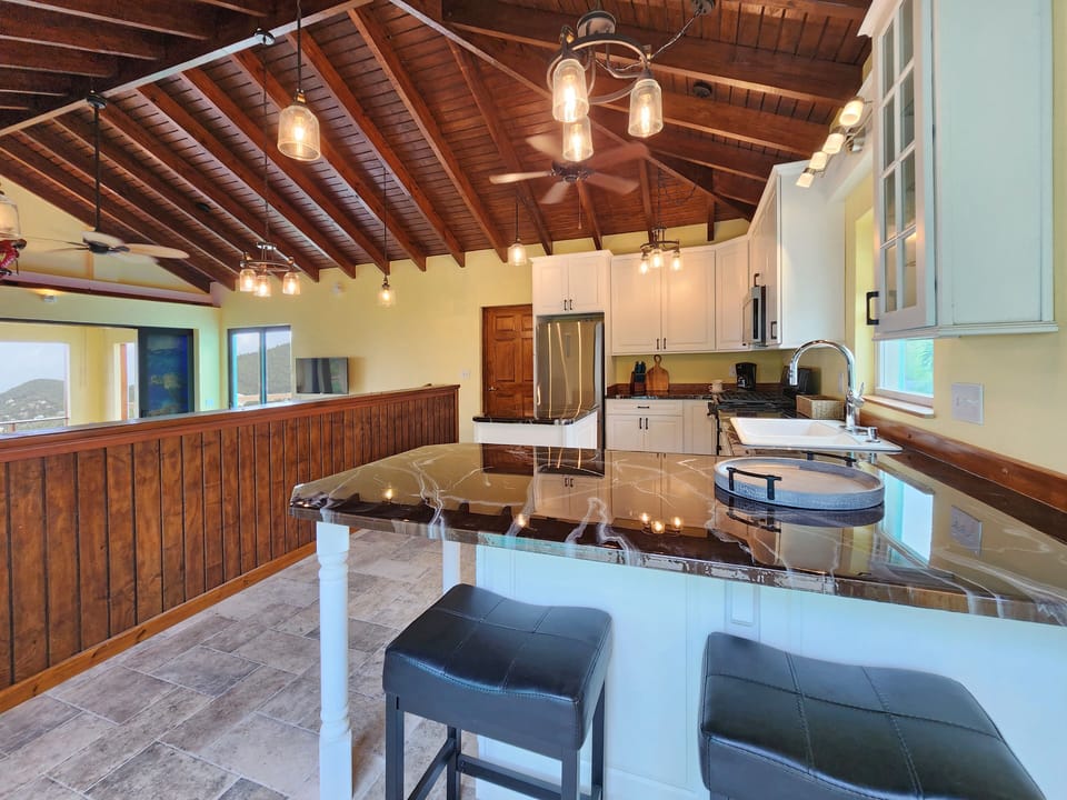 Kitchen offers breakfast bar with seating