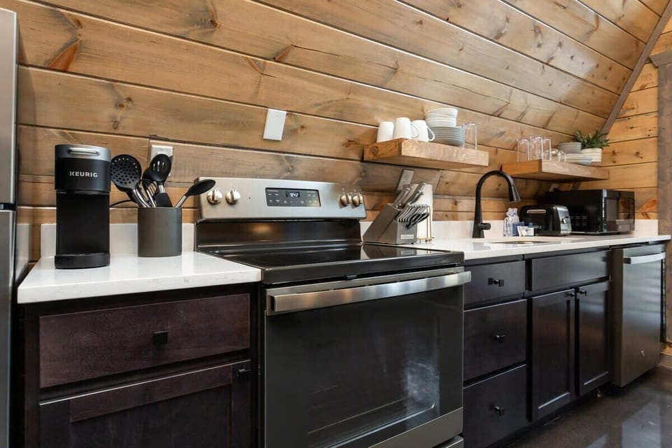 Custom Wood Cabinets Complete With Quartz Countertops And Stainless Steel Appliances In This Awesome Kitchen!