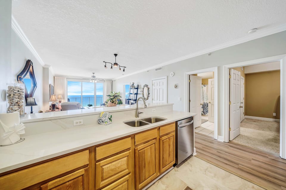 The fully equipped kitchen features granite countertops, stainless-steel appliances, and everything you need to cook meals for family and friends.