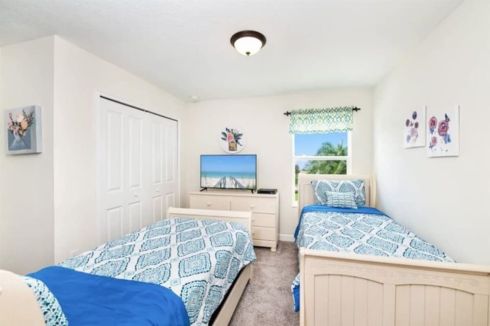 Bedroom 6, featuring 2 twin beds, is perfect for kids or friends.