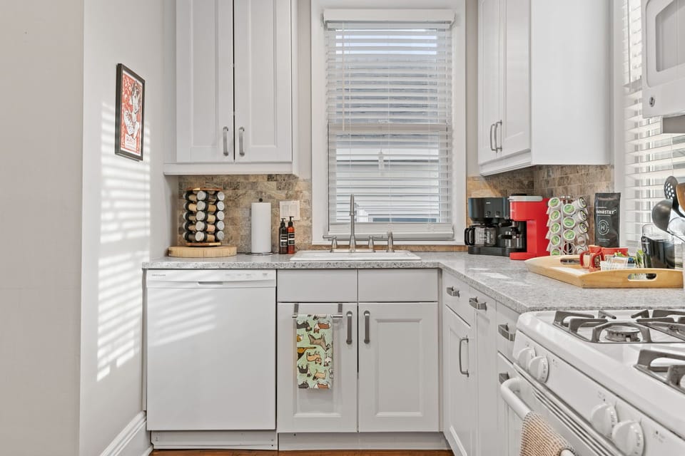 Your fully equipped kitchen invites culinary adventures with granite counters, modern appliances, and thoughtful touches like a coffee station.