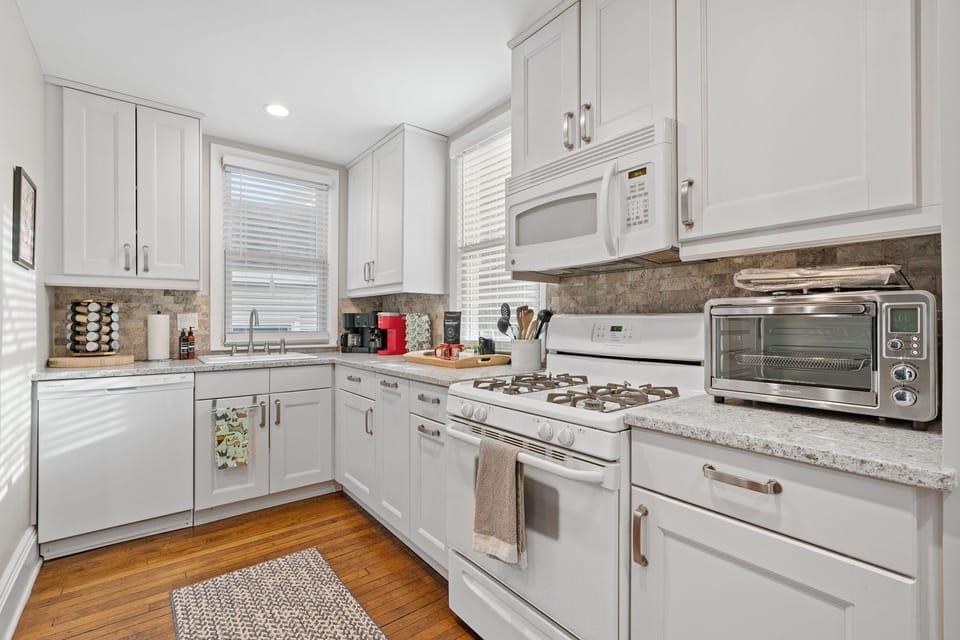 Your fully equipped kitchen awaits with granite counters, gas range, and everything you need to create memorable meals together.