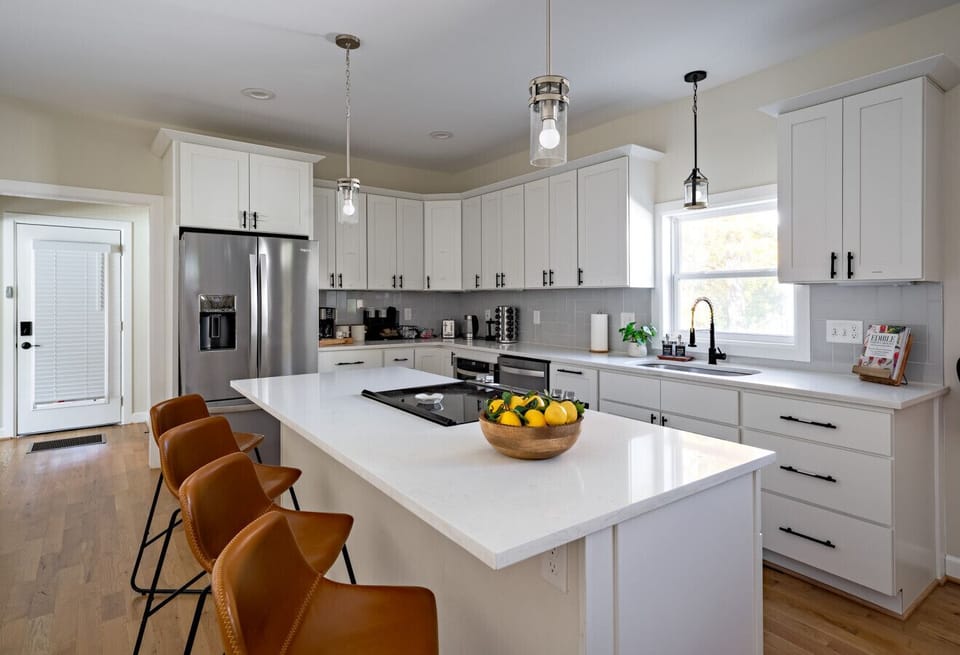 Spacious chef`s kitchen with large island and seating for the whole group
