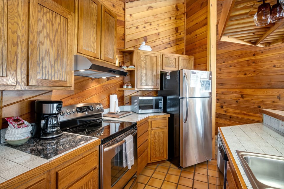 Kitchen equipped with full sized appliances, and all of the utensils you may need for meal prepping