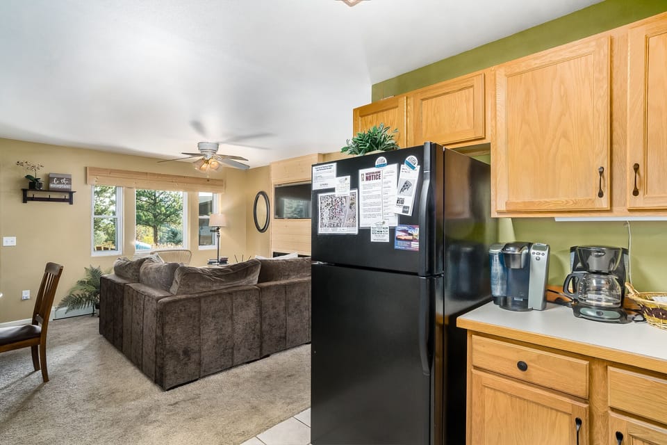 Kitchen with a full size refrigerator 