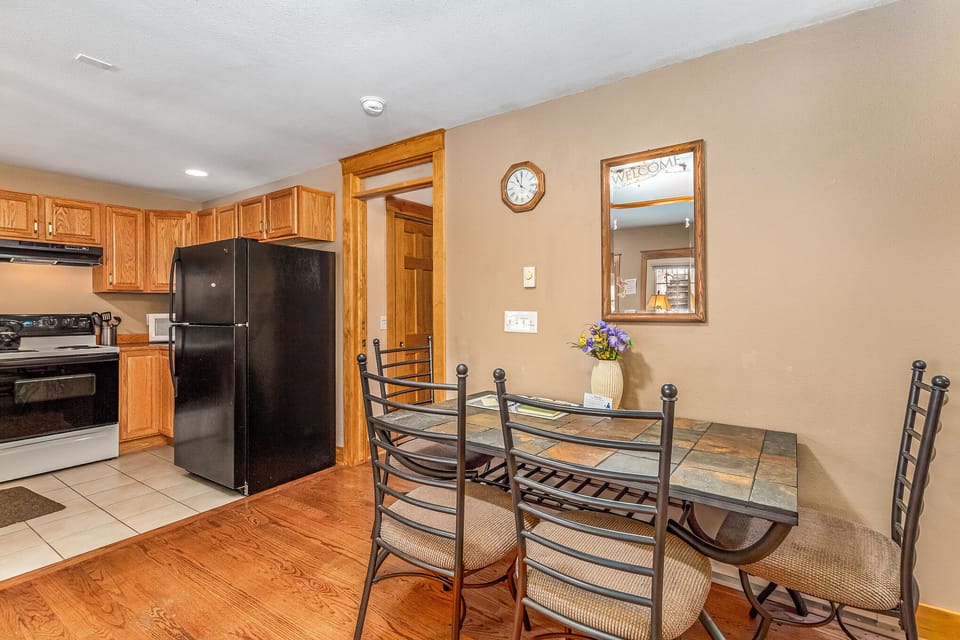 Dining table with seating for four guests.