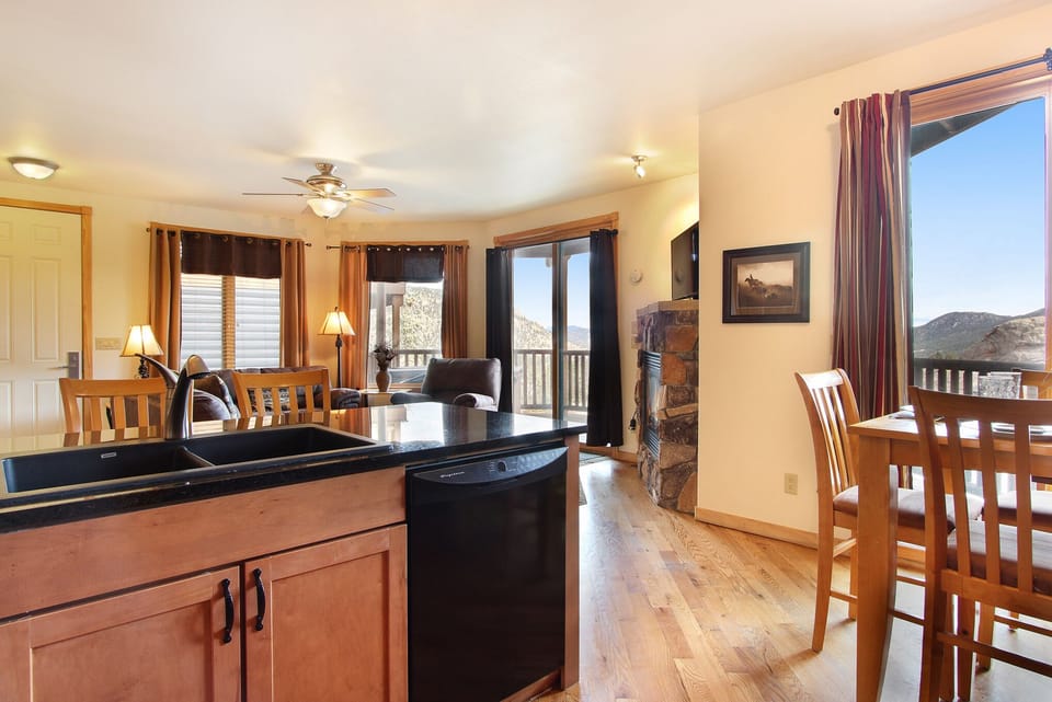 Open concept kitchen/living room with lots of windows to enjoy the beautiful views. 