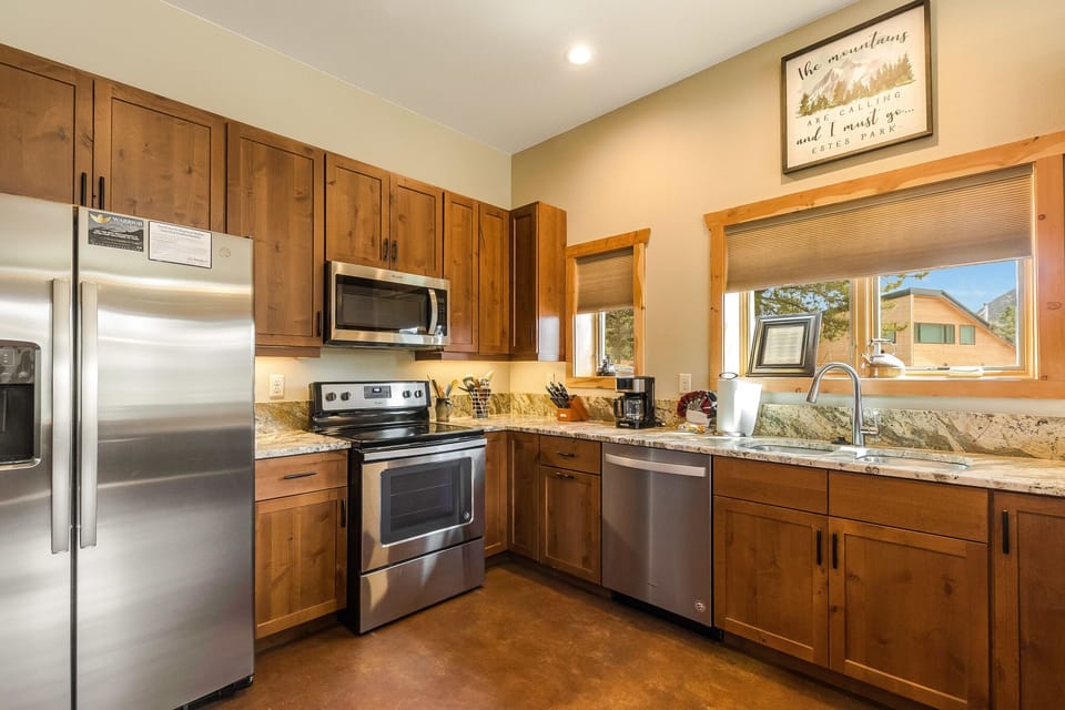 The kitchen is furnished with brand-new, full-size appliances