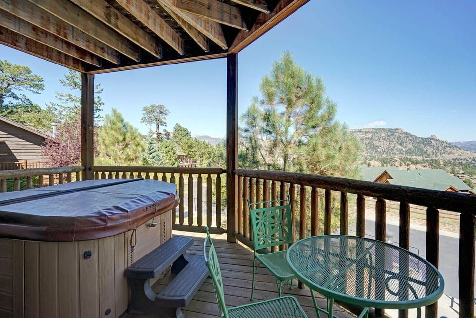 Attached deck with private use hot tub, patio seating for two, overlooking fantastic mountain views.