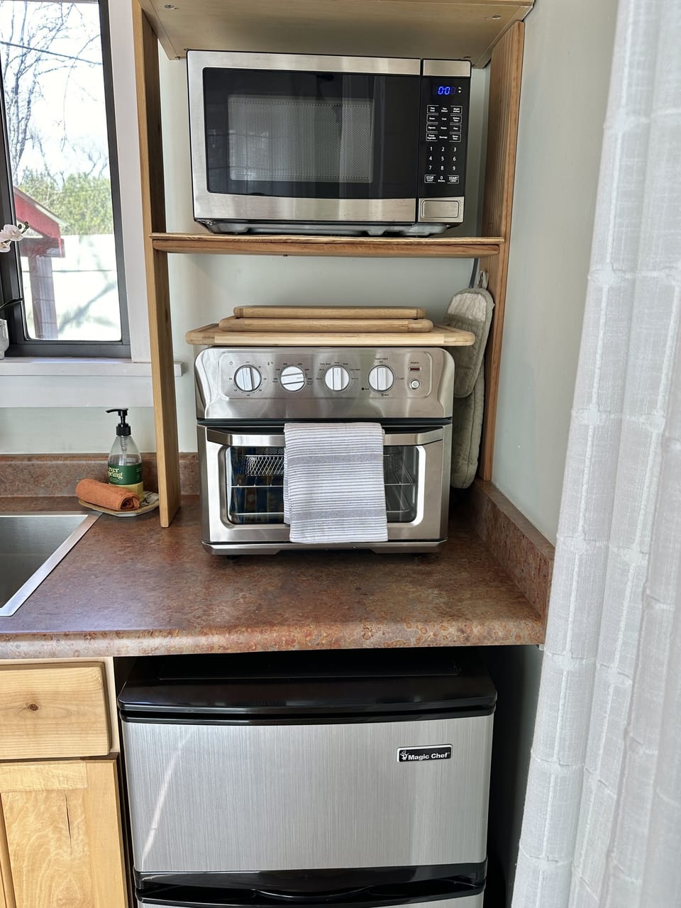 Microwave, toaster oven and mini fridge with freezer.