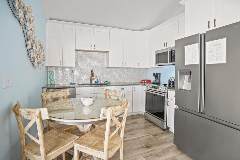 Bright kitchen with cozy dining nook and modern appliances