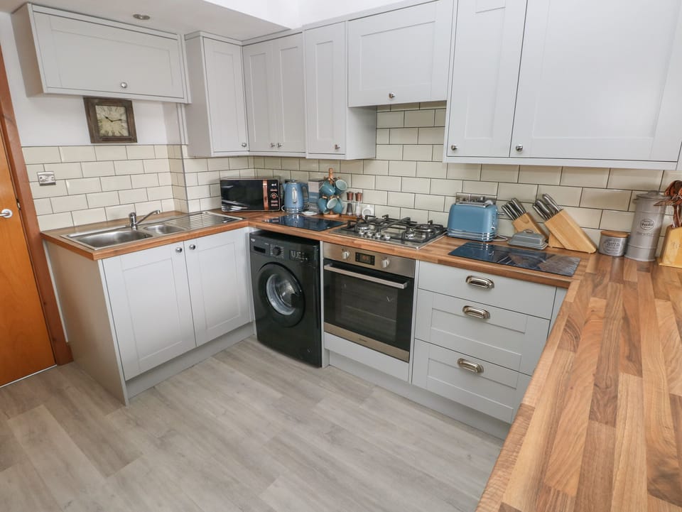 Fridge, electric kettle, toaster, cookware/dishes/utensils