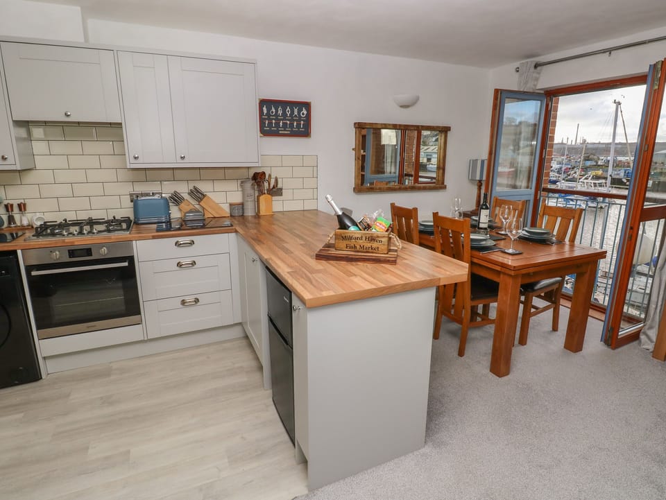 Fridge, electric kettle, toaster, cookware/dishes/utensils