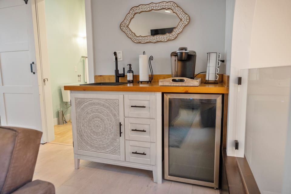 Loft kitchenette: sink, mini fridge, coffee maker, near sunroom and Bedroom #1.