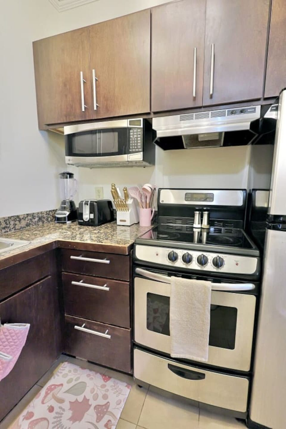 Kitchen: Cook up a storm in this stylish space with modern appliances and elegant finishes!