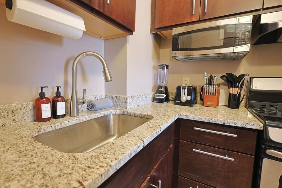 Sleek and polished. This sparkling kitchen is ready for your culinary creations.