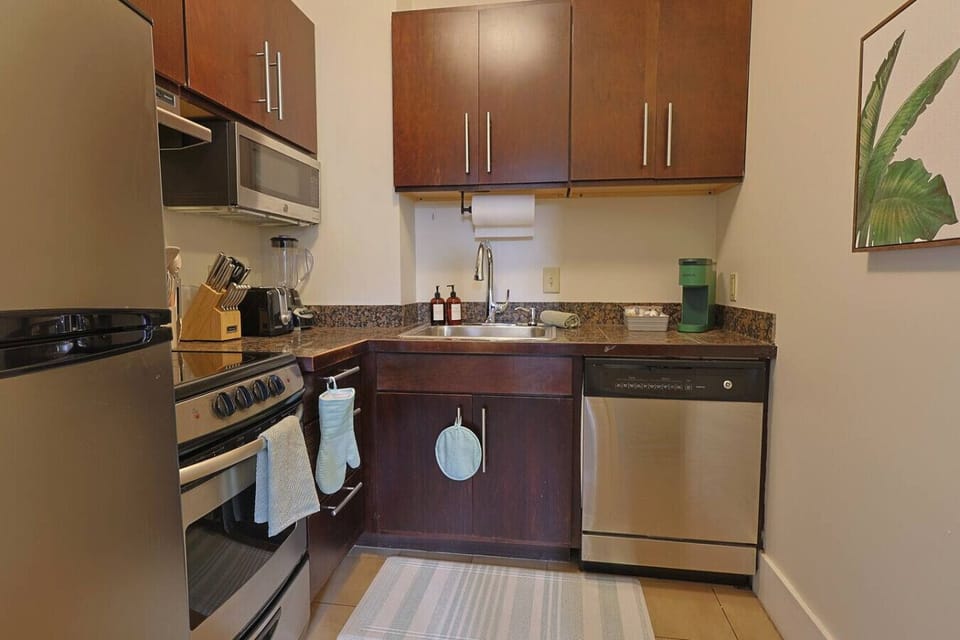 Kitchen: Sleek appliances and vibrant decor make cooking a delightful experience!
