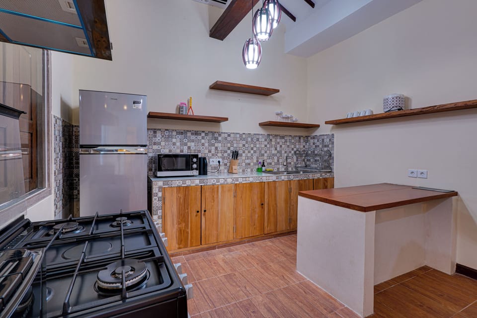Standard Villa | Private kitchen | Fridge, microwave, stovetop, electric kettle