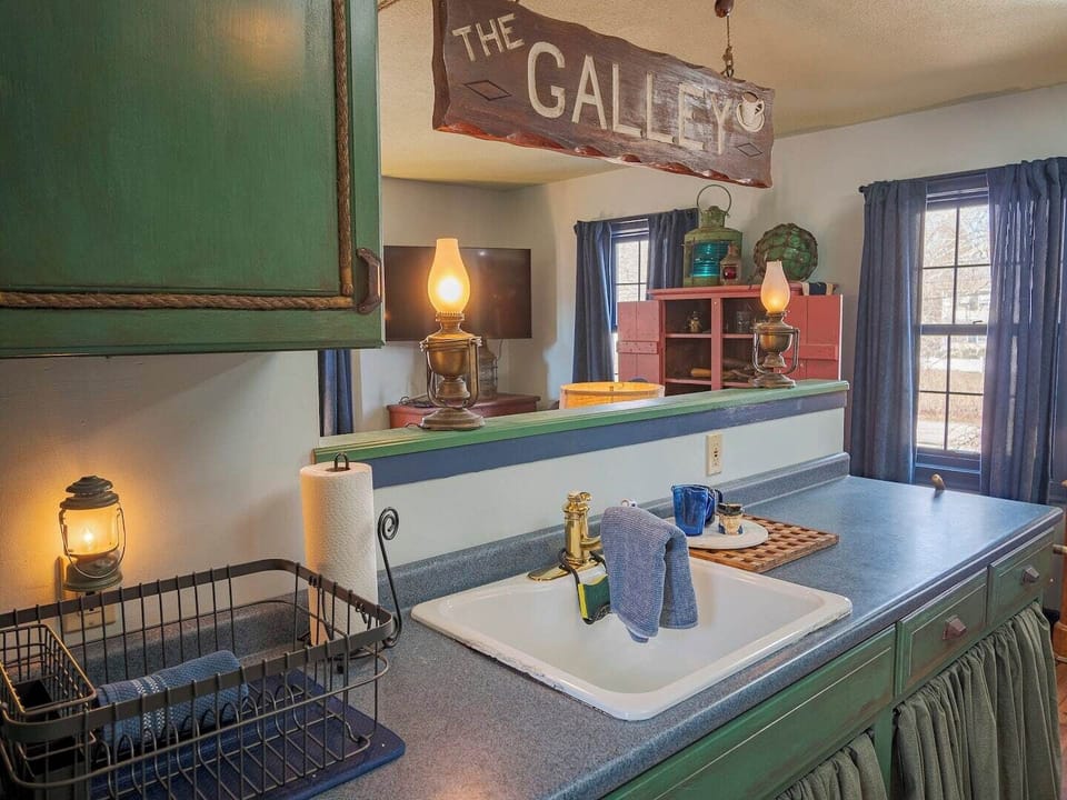 The galley kitchen opens to the living room so you can watch TV and visit with guests when you're whipping up something delicious to eat. 