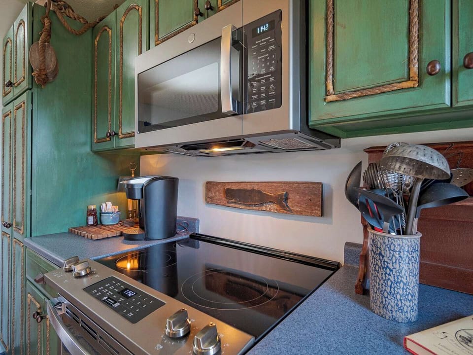All brand new appliances for you to enjoy when you're cooking from home~ be one of our first guests to experience them!  Note the coffee station to the left of the stove; Keurig coffee maker, regular drip available, k-cups, sugar, honey, tea, and rea