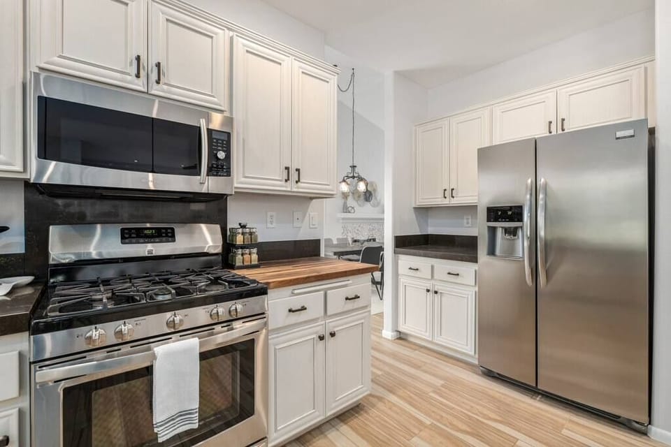 Wood block counter section. Bar area. Fridge with ice maker and filtered water. 