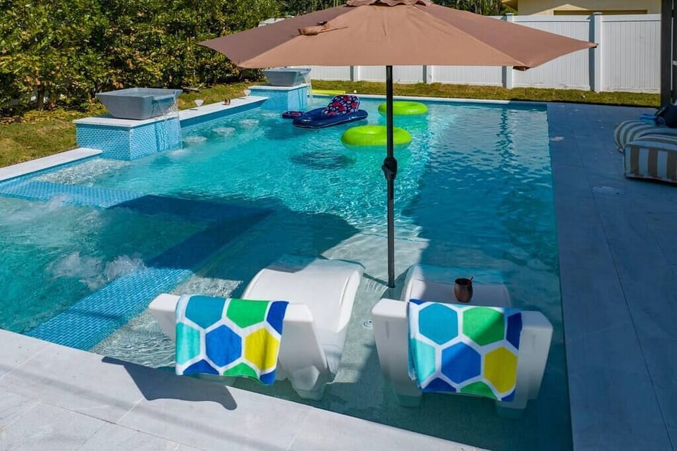 Unwind in style: A designer pool at your vacation home, where luxury meets leisure in a haven of relaxation and sophistication.
