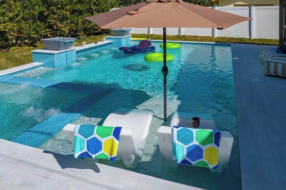 Unwind in style: A designer pool at your vacation home, where luxury meets leisure in a haven of relaxation and sophistication.