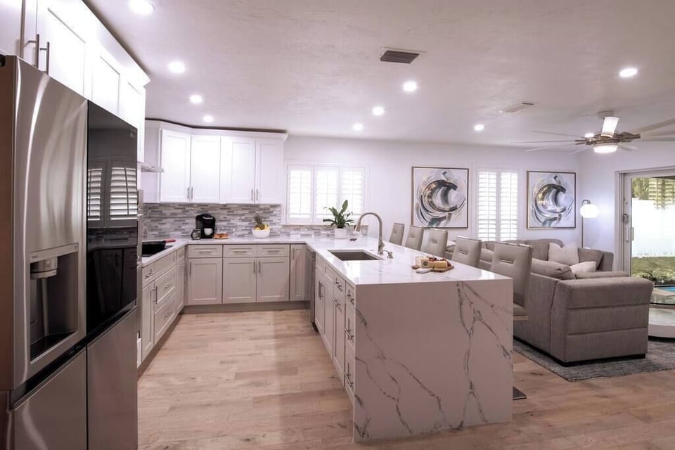 This open floor plan offers a seamless flow, fostering a sense of connectivity throughout the entire living area.