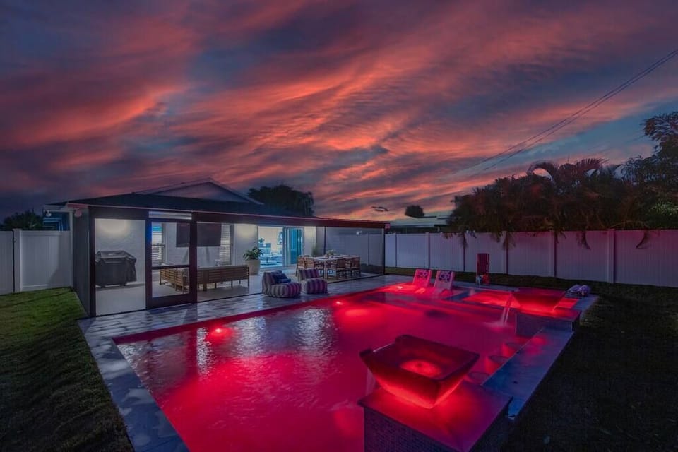 533 Posh Paradise; Where radiant hues reflect in the tranquil waters as the sun bids farewell