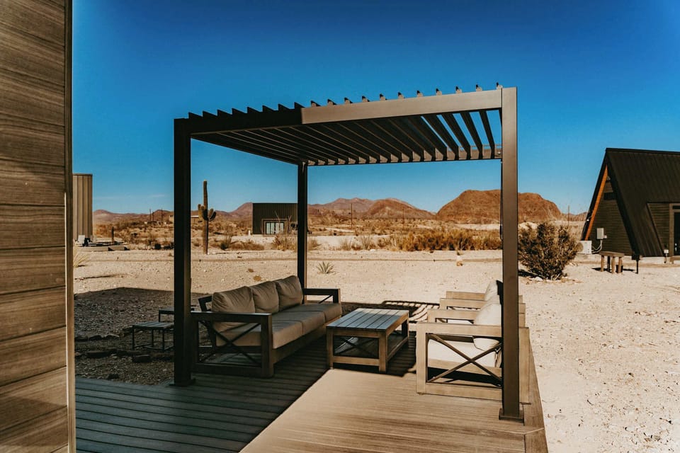 The pergola doesn't show in all exterior photos because we recently extended the deck and installed the pergola. It has a screen that can be pulled down for additional shade