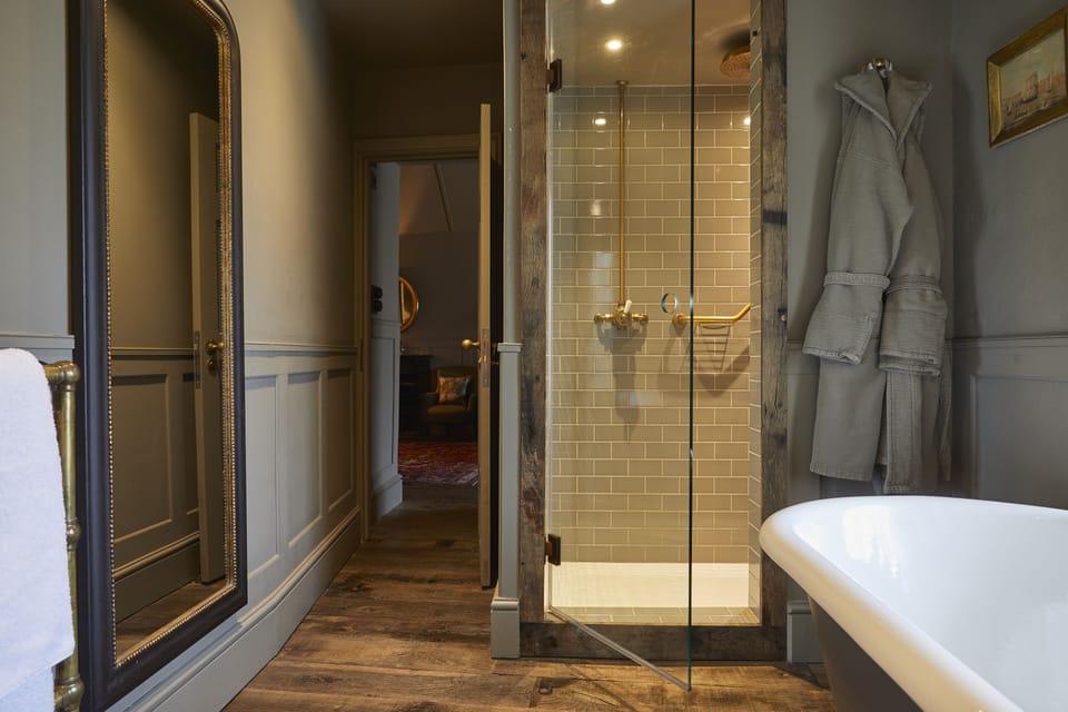Big Comfy Luxe | Bathroom | Shower, rainfall showerhead, hair dryer, bathrobes
