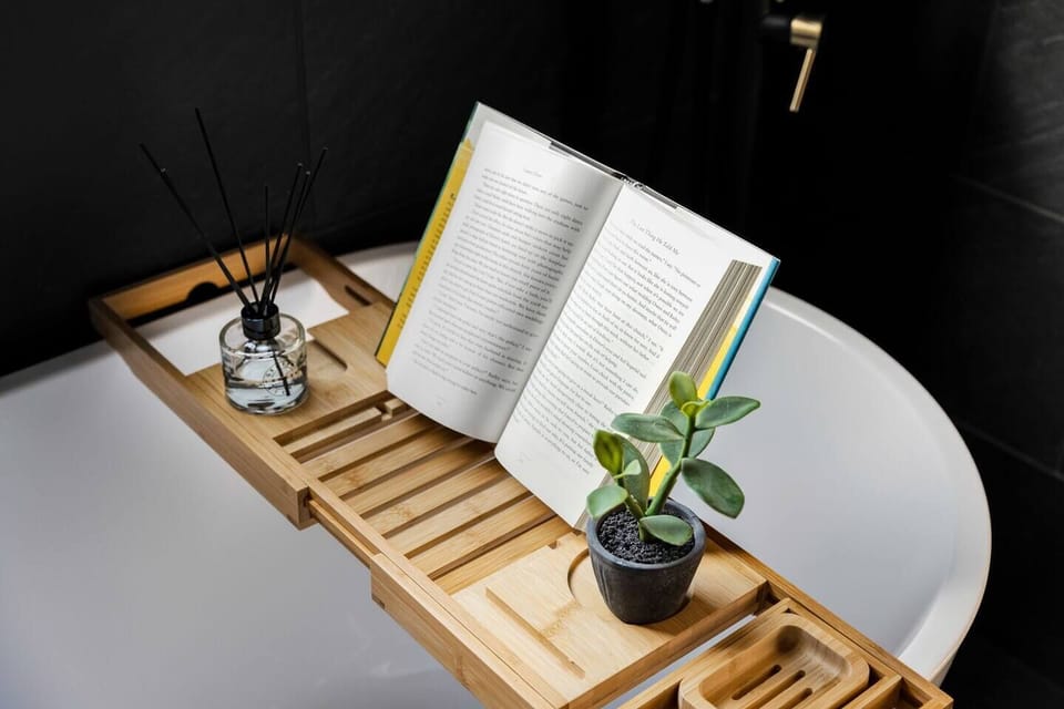 Take a soak in the primary bathroom's tub while enjoying a book...