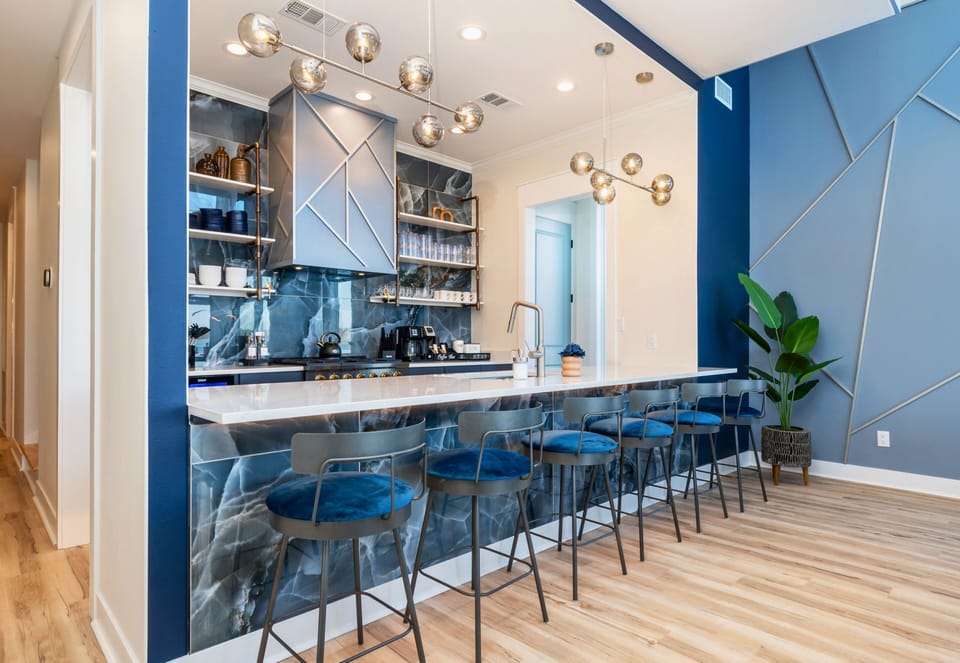 The spacious kitchen offers modern finishes, generous prep space, and everything needed for cooking meals during your stay.
