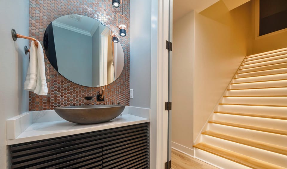 A convenient half bath tucked near the main living areas adds extra comfort and functionality during your stay.