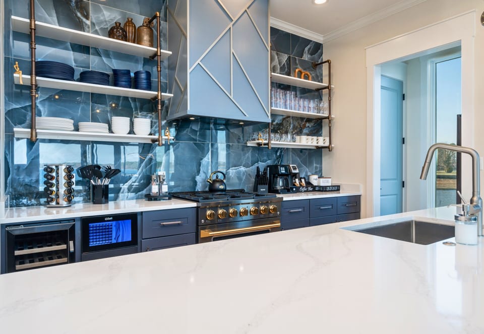 A sleek wet bar and beverage area make it simple to keep drinks chilled and entertainment flowing throughout the evening.