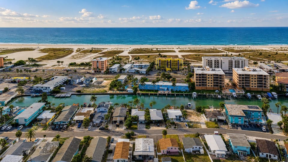 Bird’s-eye view of the surrounding neighborhood just minutes from the beach and waterfront attractions.
