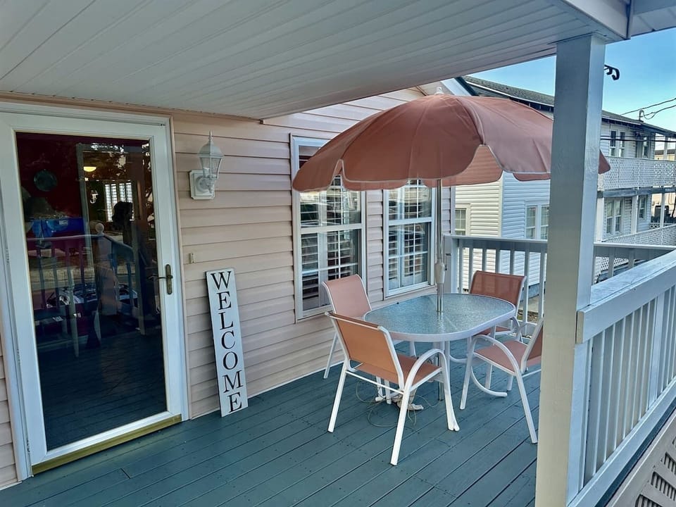 Spacious front porch, the perfect spot to relax and soak in the fresh sea breeze