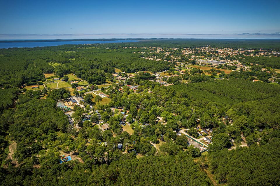 Aerial view of the expansive property, surrounded by lush landscapes and open spaces.