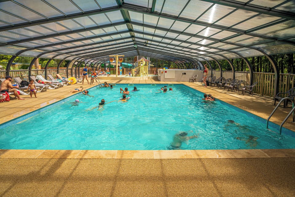 Spacious indoor pool with ample room for swimming and relaxation.