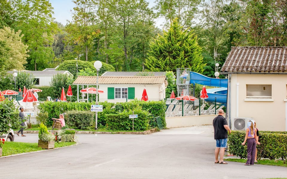 A charming campground scene, with paths and greenery creating a welcoming environment for leisurely strolls and community connections.