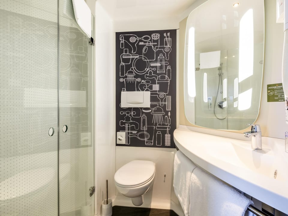 Shower, eco-friendly toiletries, hair dryer, towels