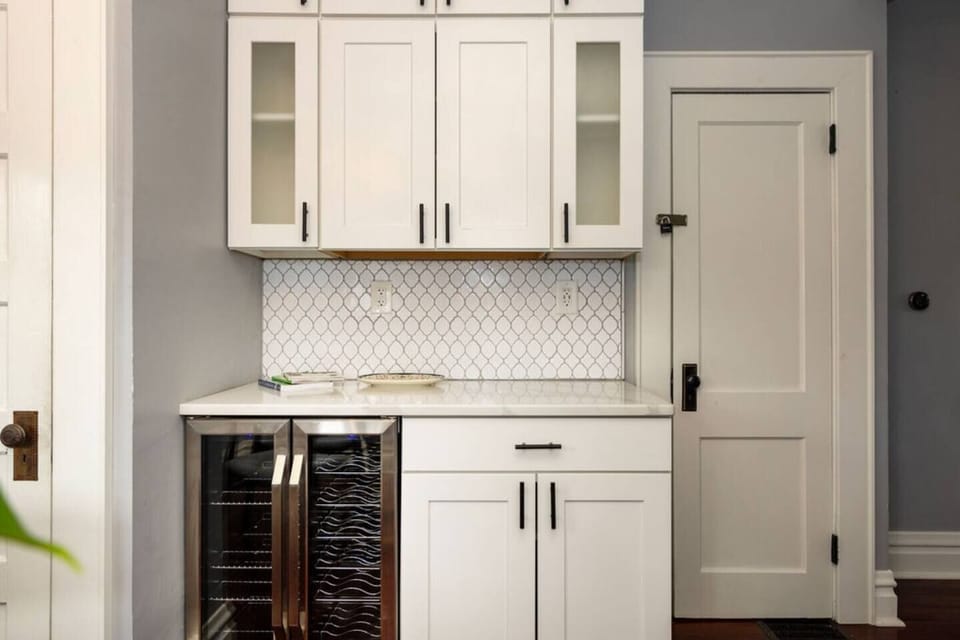 Wine cooler with sides for both white and red wine, electric wine opener and several wine glasses and bourbon glasses.  There are also grill items in the drawer if you want to grill out while staying!