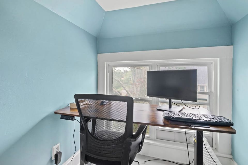 Our guests love that they don't have to sacrifice remote-work comfort here. This quiet upstairs loft workspace is perfect for getting things done while the rest of the family enjoys the home downstairs. Or a perfect space for littles to sleep in the crib.