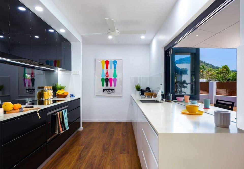 Full Kitchen with Nespresso Citiz coffee machine, Pods, Pots, Pans, Utensils & Essentials plus easy outdoor bar table access for outdoor meals or watching the kids in the pool
