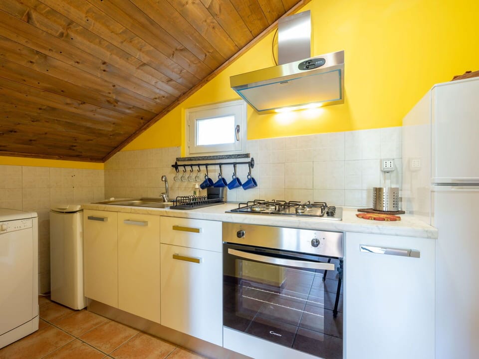 Cabinetry, Countertop, Building, Property, Kitchen Stove, Kitchen Appliance, Kitchen, Kitchen Sink, Gas Stove, Wood