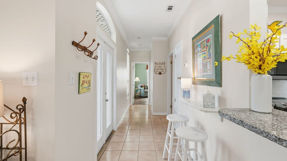 Hallway from living room, kitchen, dining area to master bedroom on first floor