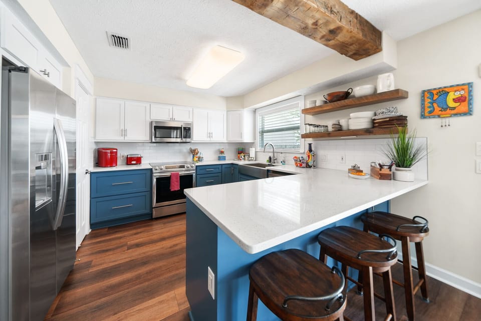 Your fully-equipped kitchen blends modern convenience with charming rustic touches, featuring stainless steel appliances and a spacious island for memorable meal prep.